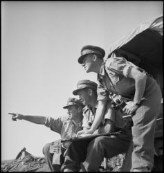 Date: 3 May 1943 By: Elias, M D, active 1943
Ref: DA-03035-F
Artillery officers discussing a problem in Tunisia during World War II. Photograph taken on 3 May 1943 by M D Elias.