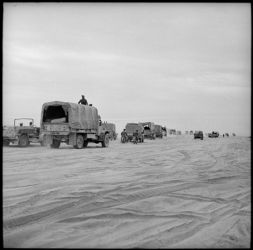 Date: Nov 1942 By: Paton, Harold Gear, 1919-2010
Ref: DA-02723-F
Through a sea of sand the NZ convoy in the van of the Allied forces pursuing Axis forces towards Benghazi, during World War II. Photograph taken in November 1942 by H Paton.