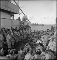 Ref: DA-04540-F
Maori Battalion entertaining New Zealand World War 2 troops of 2nd Division, while travelling by troopship from Egypt to Italy. Photographer, ship, and exact date, unidentified.