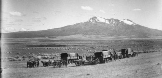 Date: ca 1940
Ref: 1/2-047772-G
Groups of soldiers lined up beside gun carriages and covered trucks. Mount Ruapehu can be seen in the distance across the plateau. Photographed by Sydney Charles Smith in about 1940
Waiouru Military Camp opened 1938/1939 Soldiers lined up on what will become Waiouru Military Camp - Waiouru 1940